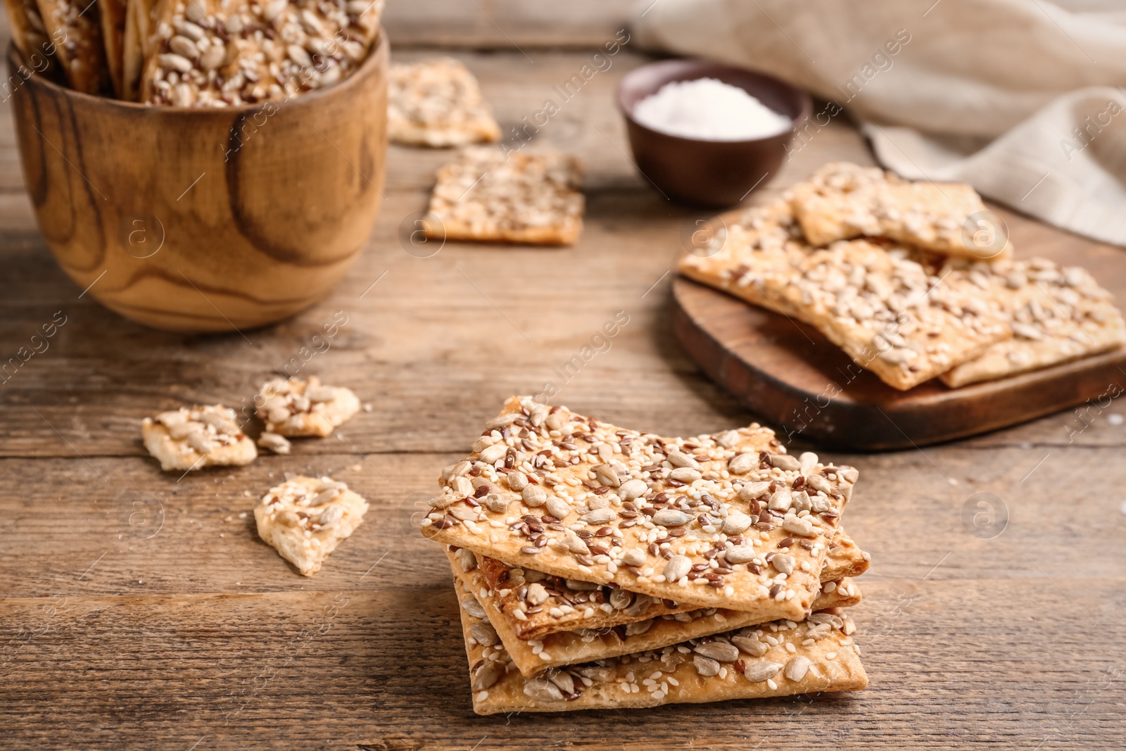 Photo of Stack of delicious crackers on wooden table