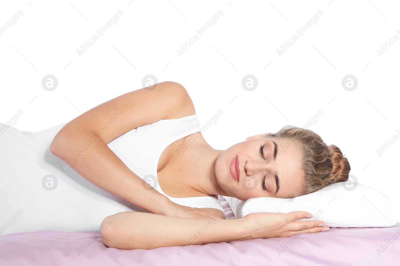 Photo of Beautiful woman sleeping with orthopedic pillow on bed against white background