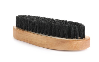 Photo of New wooden brush isolated on white. Shoe care product