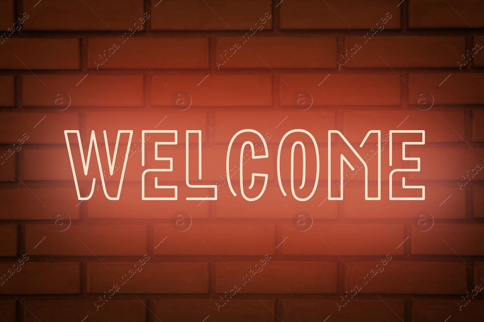 Image of Stylish neon sign WELCOME on brick wall