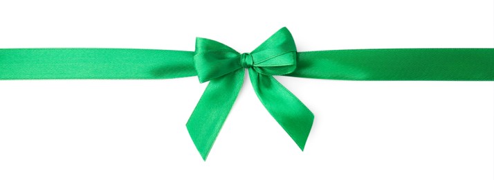 Photo of Green satin ribbon with bow isolated on white, top view