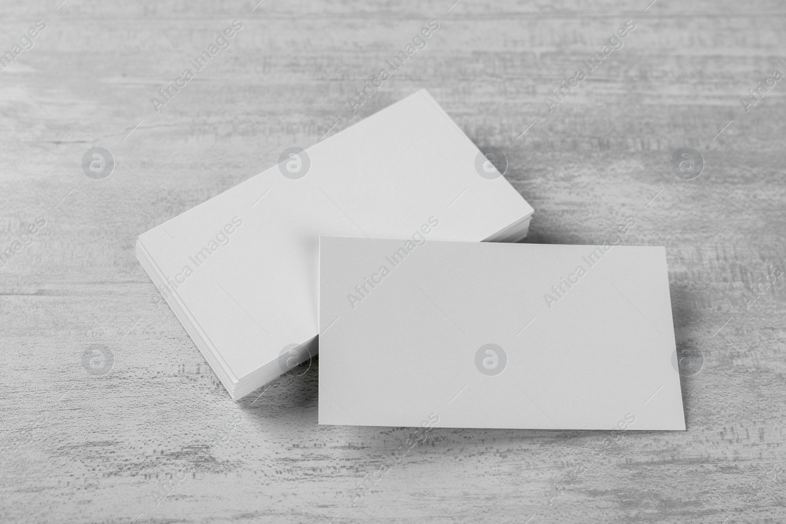 Photo of Blank business cards on white table. Mockup for design