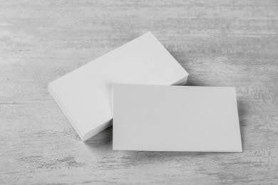 Photo of Blank business cards on white table. Mockup for design