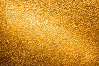 Image of Golden textured surface as background, closeup view