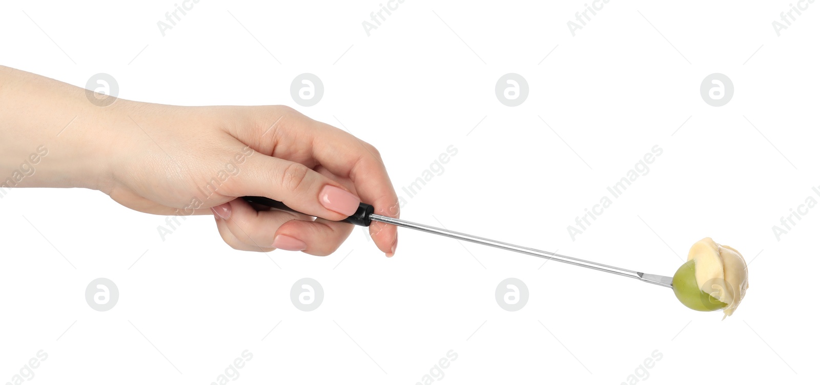 Photo of Tasty fondue. Woman holding fork with grape and melted cheese on white background, closeup