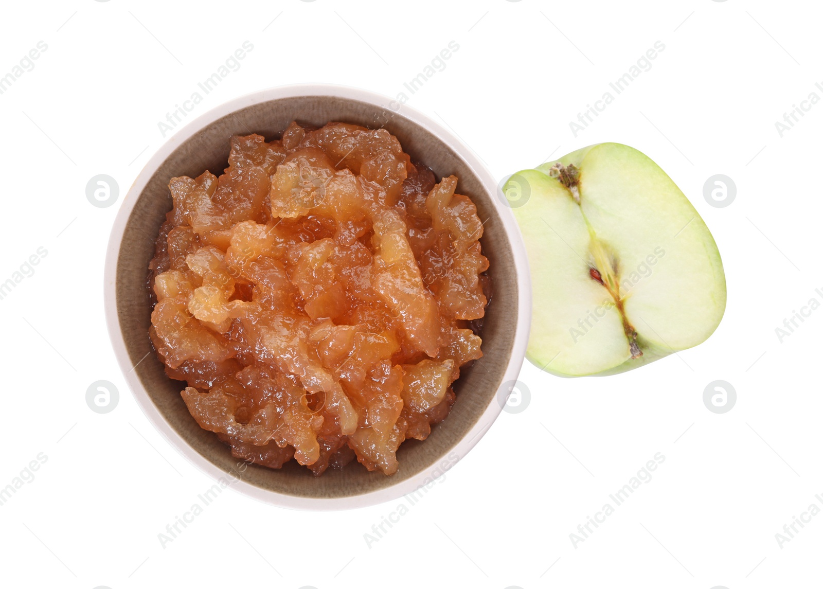 Photo of Delicious apple jam in bowl and half of fresh apple isolated on white, top view