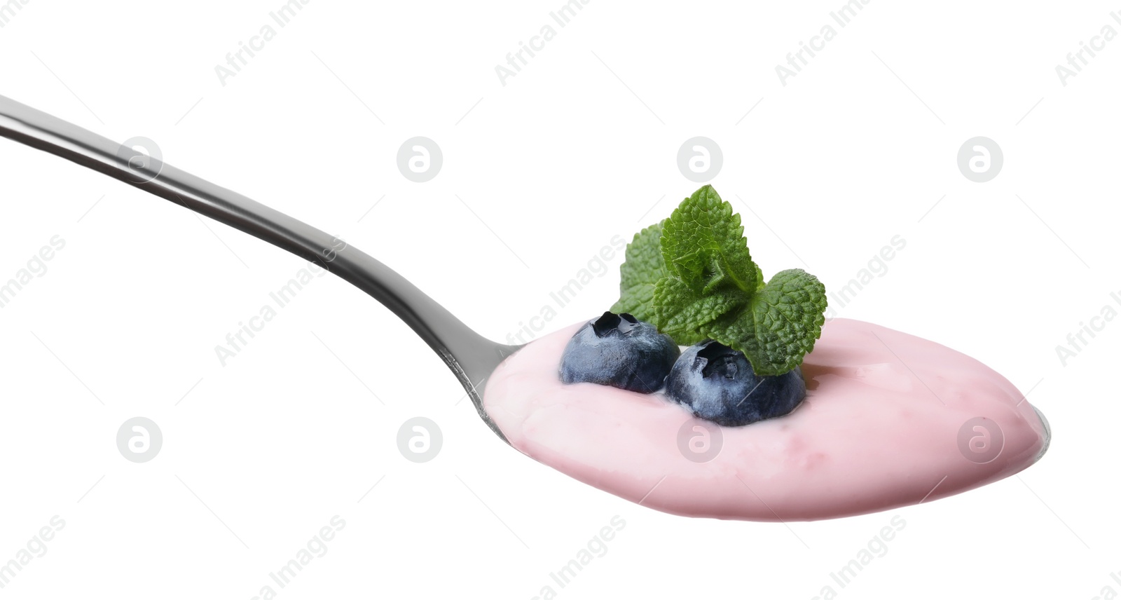 Photo of Spoon with yogurt, blueberries and mint isolated on white