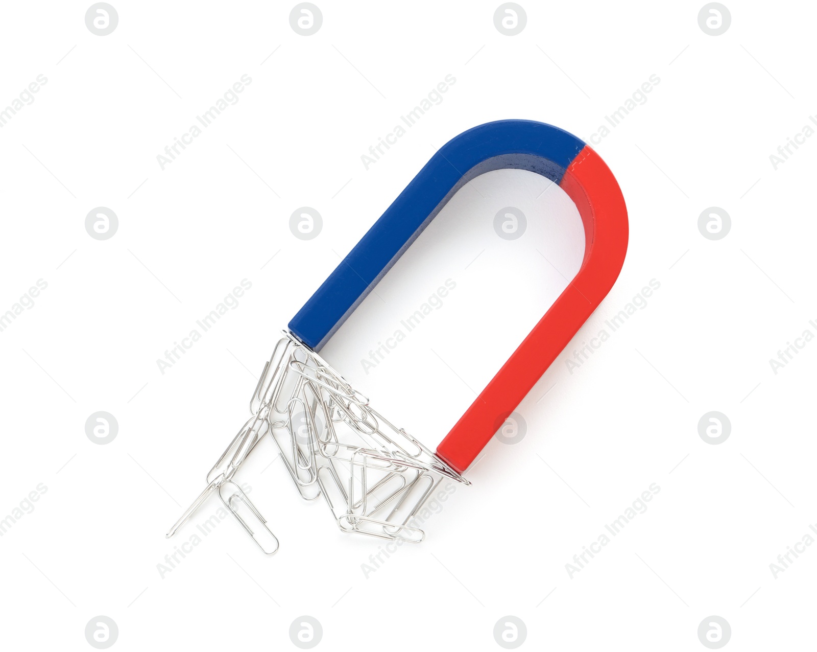 Photo of Magnet attracting paper clips on white background, top view