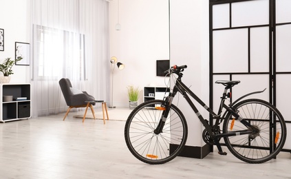 Light living room interior with modern bicycle