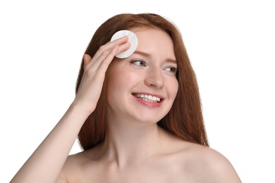 Photo of Smiling woman with freckles wiping face on white background