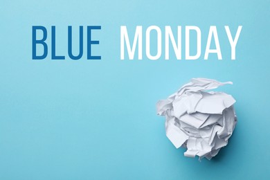 Crumpled sheet of paper and text Blue Monday on color background, top view 