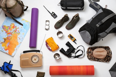 Photo of Flat lay composition with camping equipment on white background