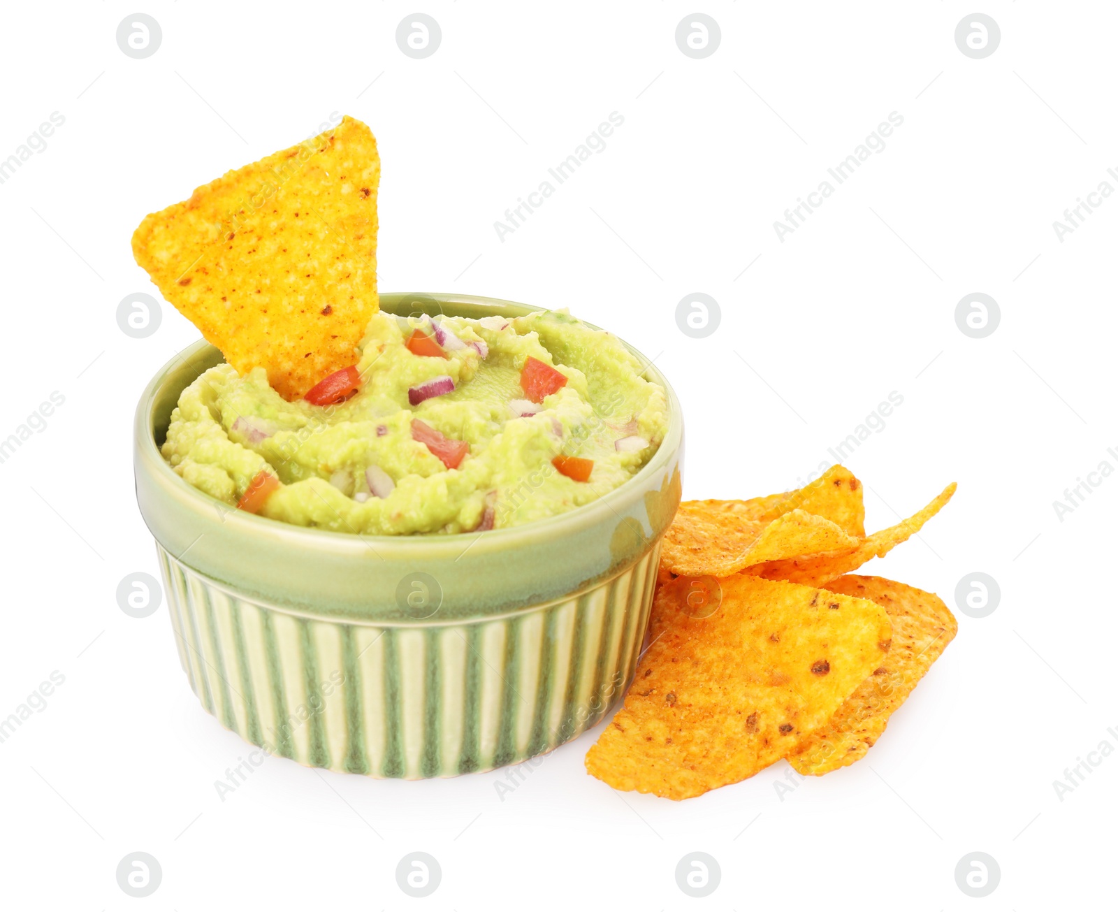 Photo of Bowl of delicious guacamole and nachos chips isolated on white