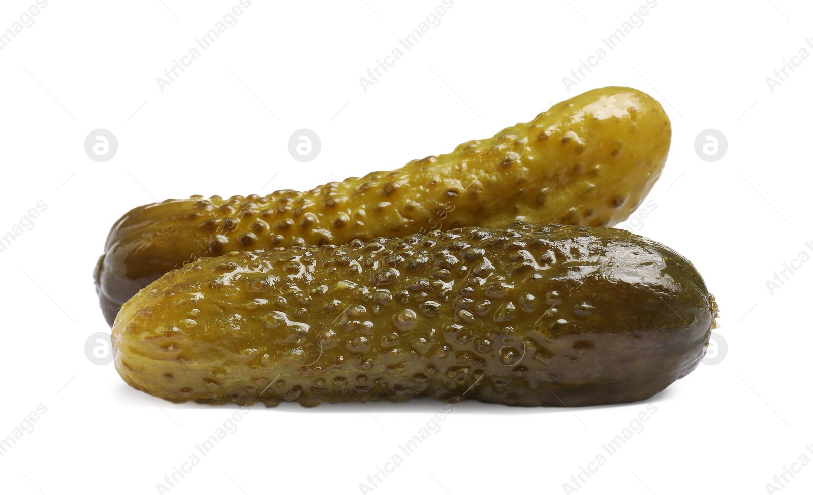 Photo of Two tasty pickled cucumbers isolated on white