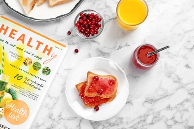 Photo of Toasts with sweet jam on light background, flat lay composition