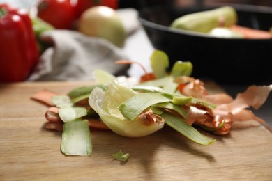 Photo of Peels of fresh vegetables on table, closeup