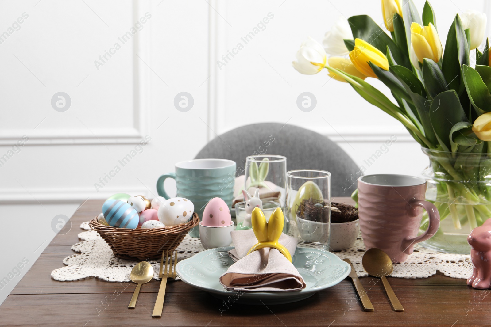 Photo of Festive table setting with beautiful flowers. Easter celebration