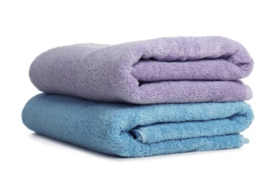 Folded soft terry towels on white background