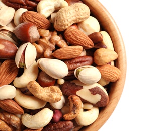 Photo of Bowl with mixed organic nuts on white background, closeup