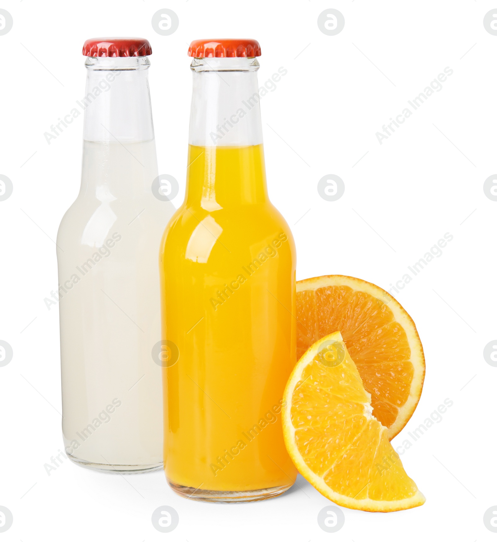 Photo of Delicious kombucha in glass bottles and orange isolated on white