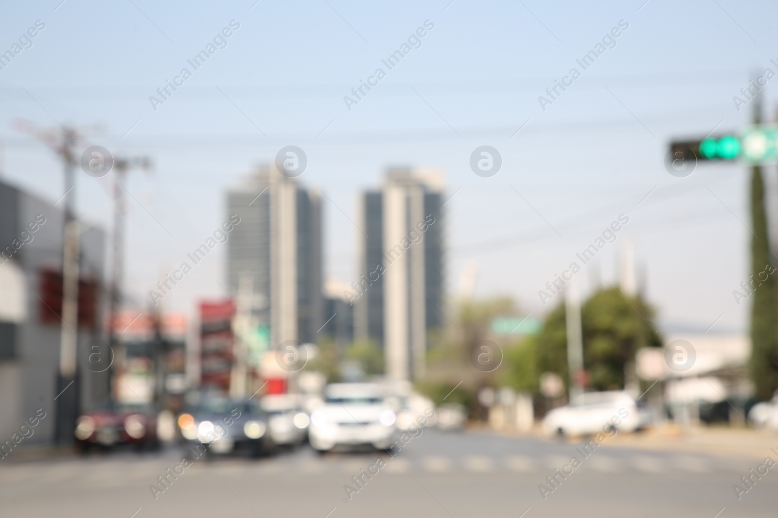 Photo of San Pedro Garza Garcia, Mexico – March 20, 2023: Blurred view of road with cars and buildings, bokeh effect