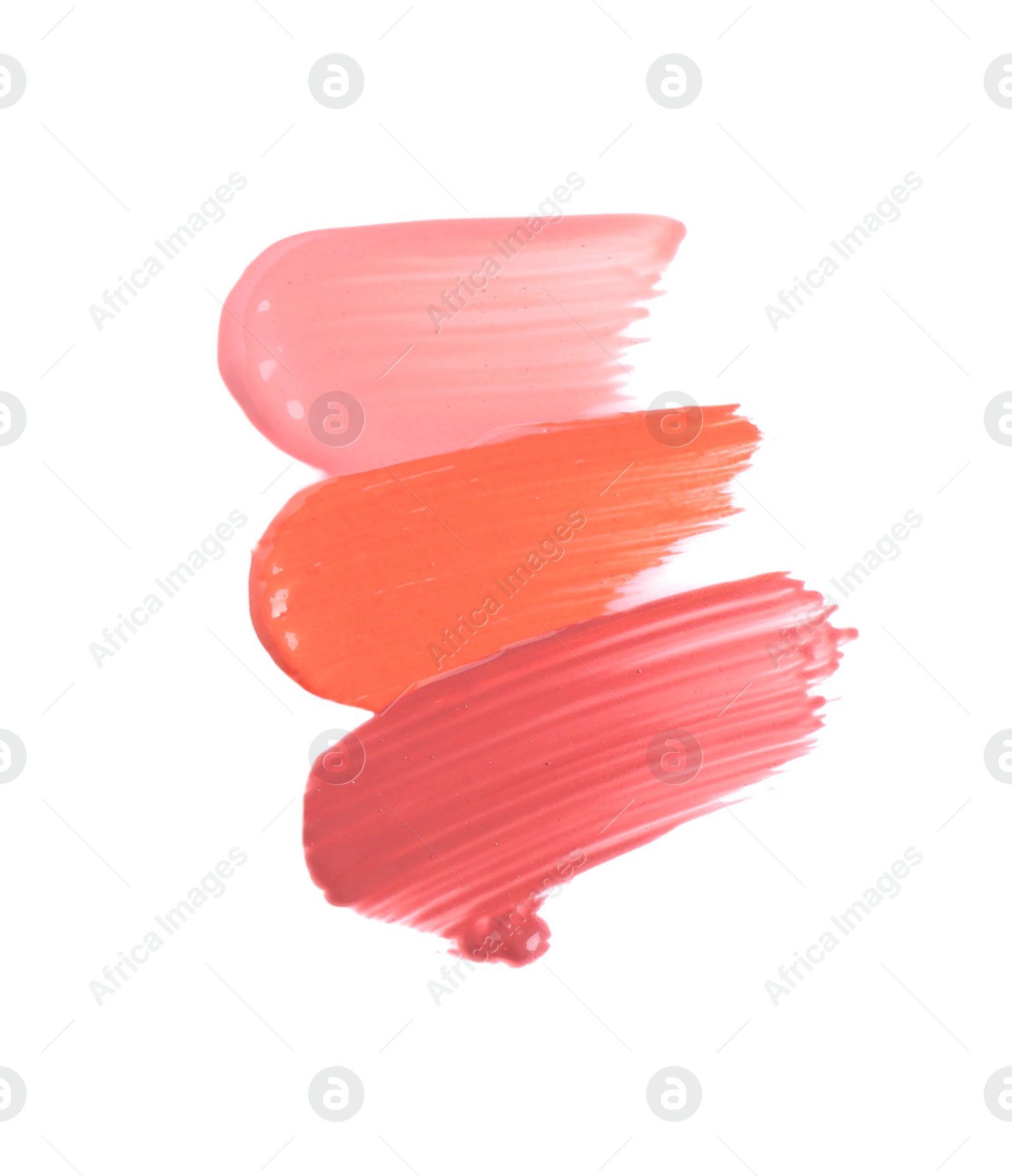 Photo of Strokes of different lip glosses isolated on white, top view