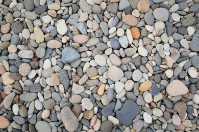 Photo of Pile of pebbles as background, top view