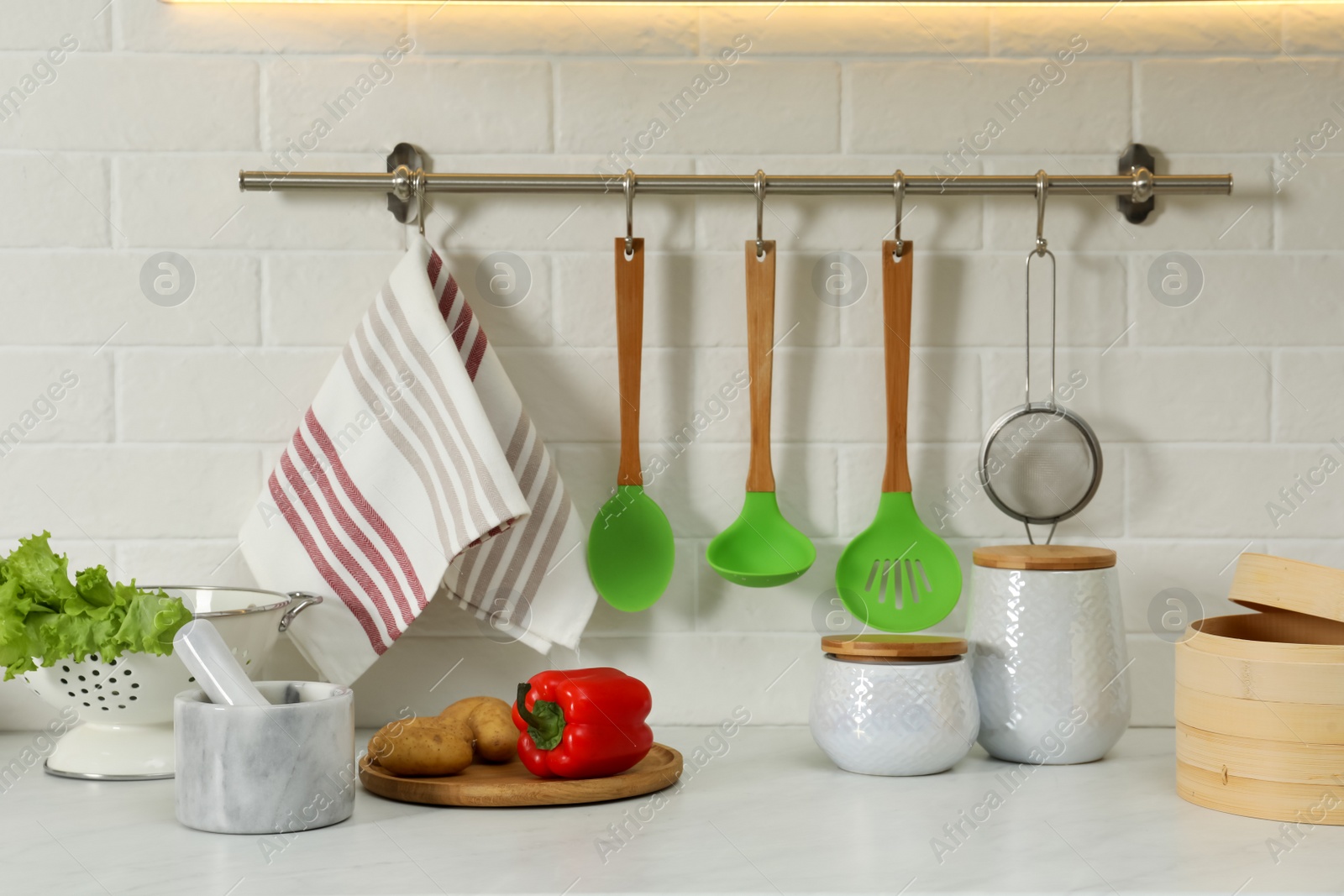 Photo of Countertop with different cooking utensils and products in kitchen