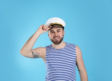 Photo of Portrait of sailor on light blue background