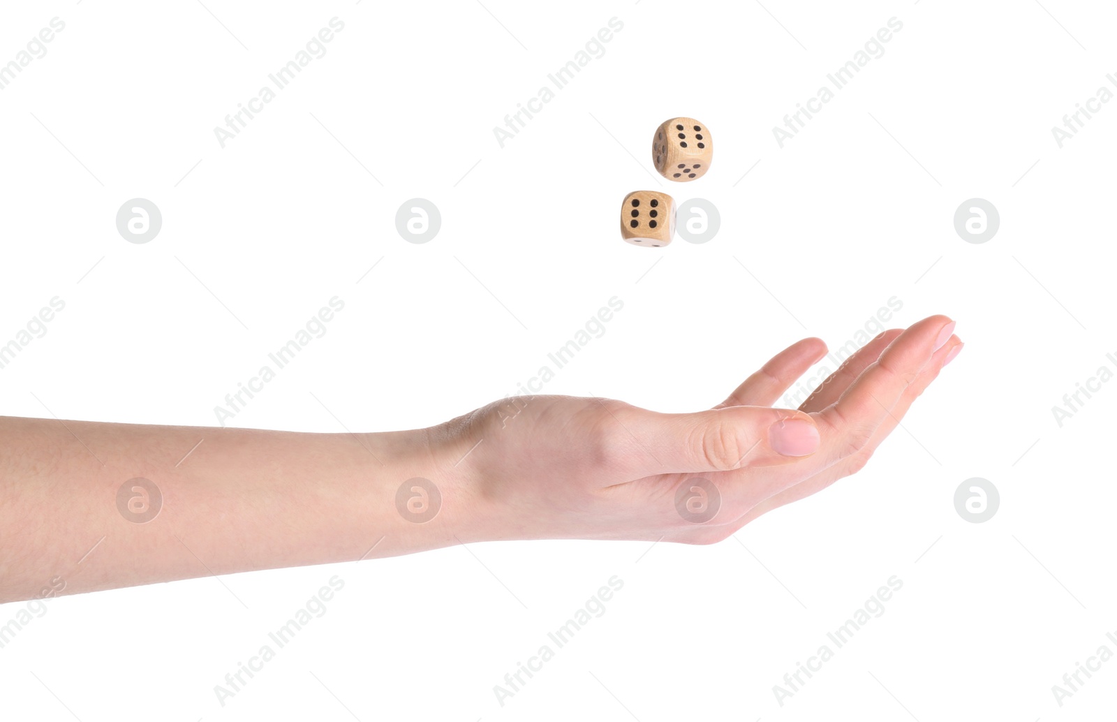 Photo of Woman throwing game dices on white background, closeup