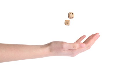 Photo of Woman throwing game dices on white background, closeup