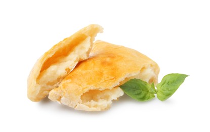 Photo of Delicious samosa and basil isolated on white. Homemade pastry