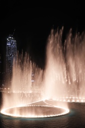 DUBAI, UNITED ARAB EMIRATES - NOVEMBER 04, 2018: Famous dancing fountain show on Burj Khalifa lake at night