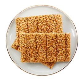 Photo of Delicious kozinaki bars on white background, top view