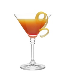 Photo of Glass of martini cocktail with lemon zest on white background