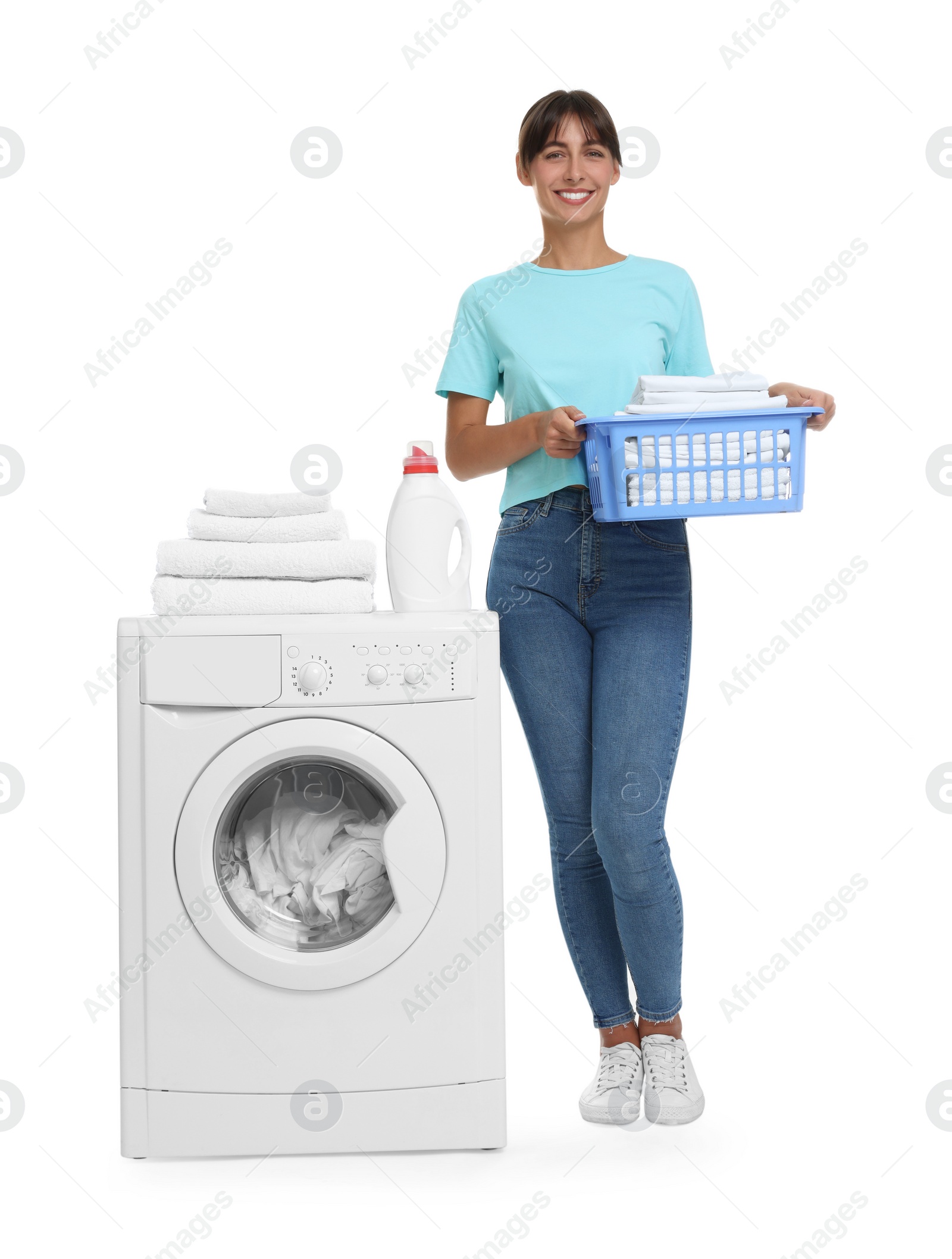 Photo of Beautiful woman with laundry basket near washing machine on white background