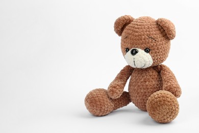Photo of Cute crocheted bear isolated on white. Children's toy