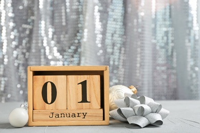 Wooden block calendar and decor on table. Christmas countdown