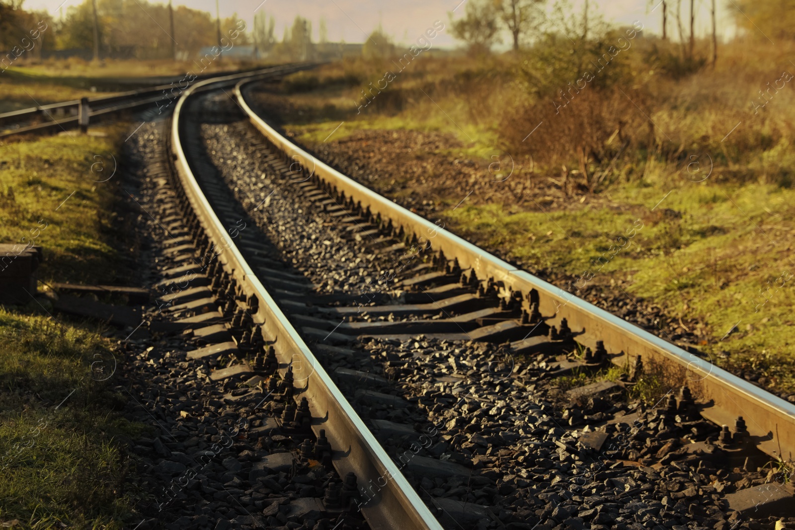 Photo of Railway line in countryside on sunny day. Train journey