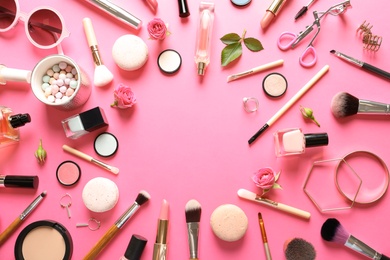 Photo of Flat lay composition with products for decorative makeup on pink background