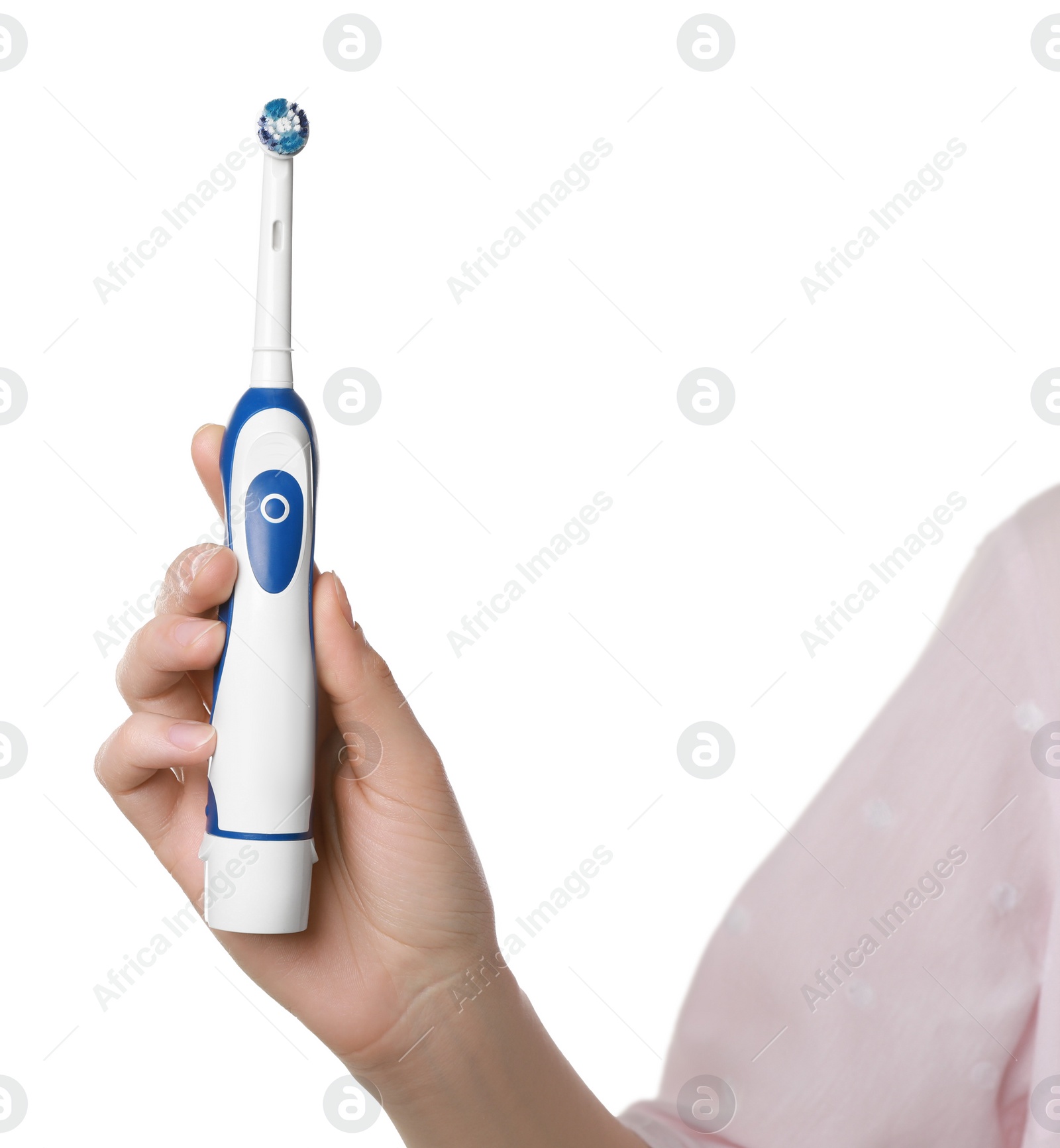 Photo of Woman holding electric toothbrush on white background, closeup