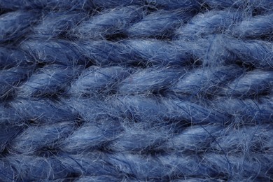 Photo of Macro photo of blue knitted fabric as background, top view