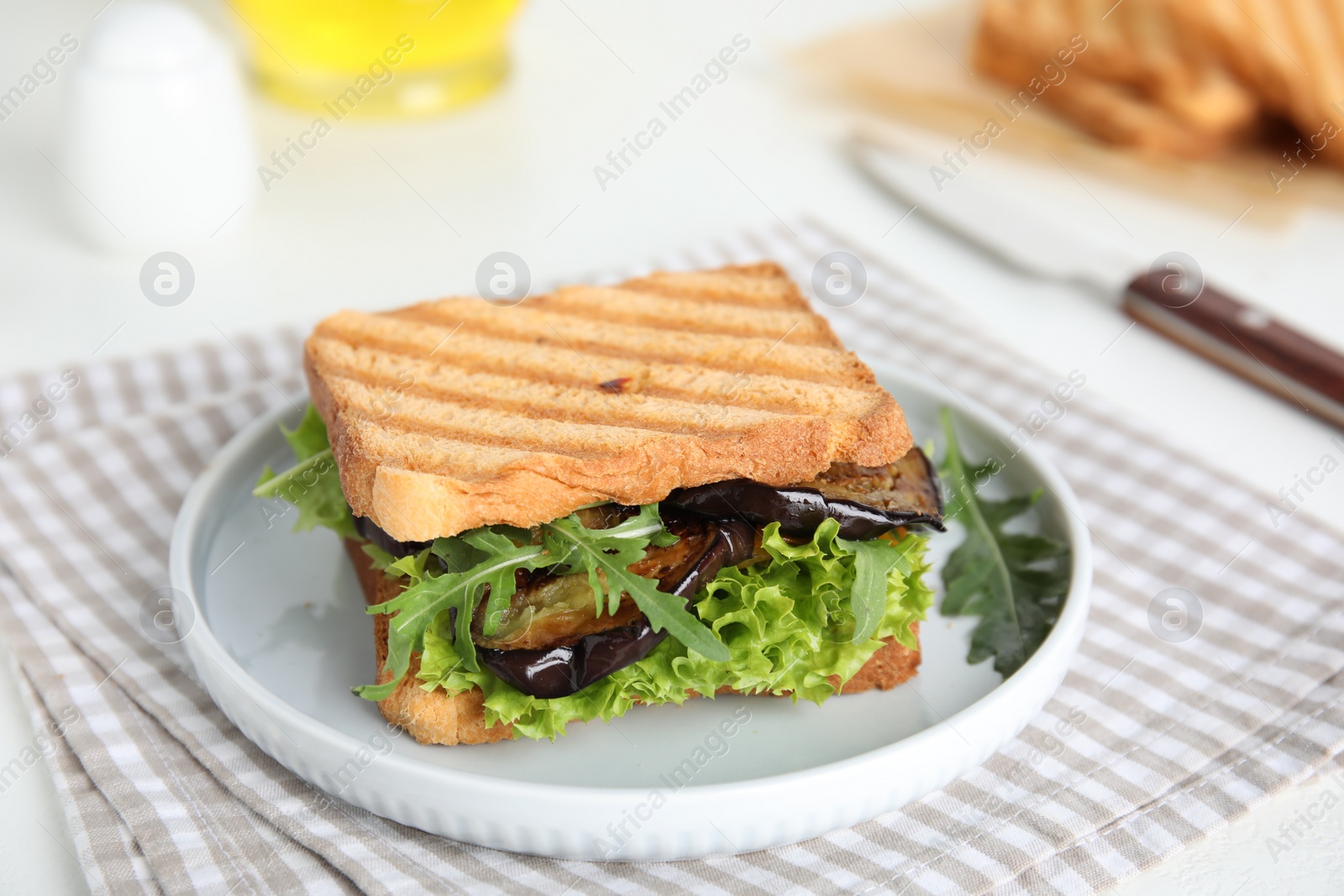 Photo of Delicious fresh sandwich with eggplant served on white table