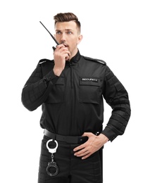 Male security guard using portable radio transmitter on white background