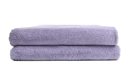 Photo of Folded clean soft towels on white background