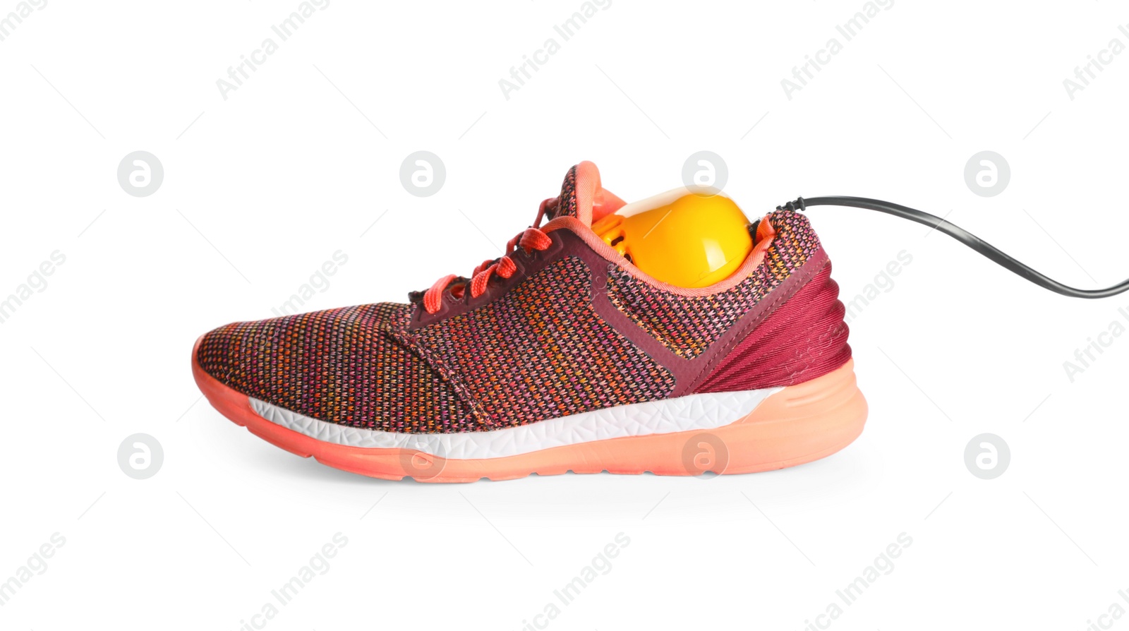 Photo of Stylish sneaker with modern electric shoe dryer on white background