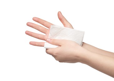 Woman wiping hands with paper towel on white background, closeup
