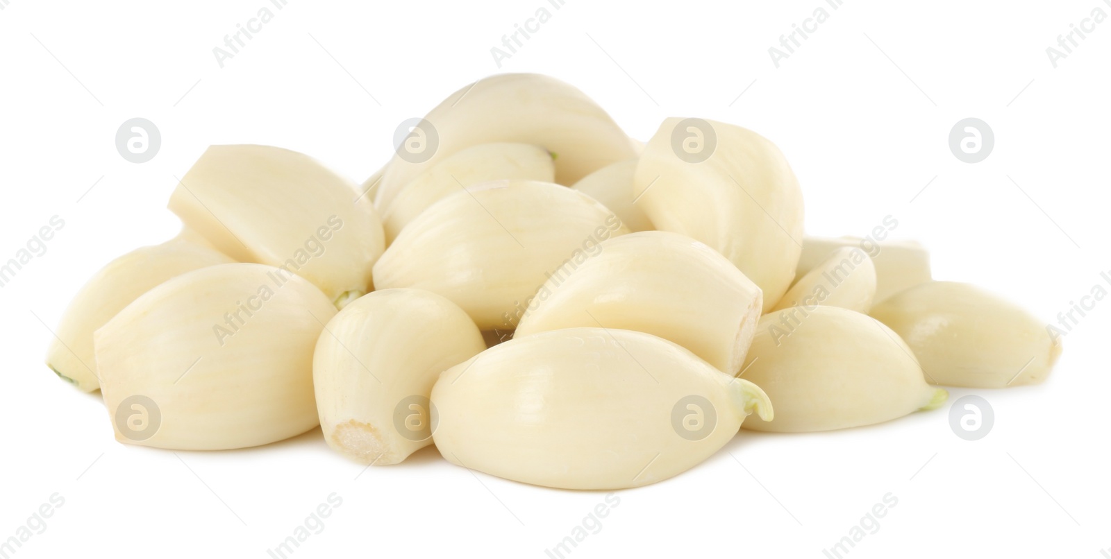 Photo of Peeled cloves of fresh garlic isolated on white