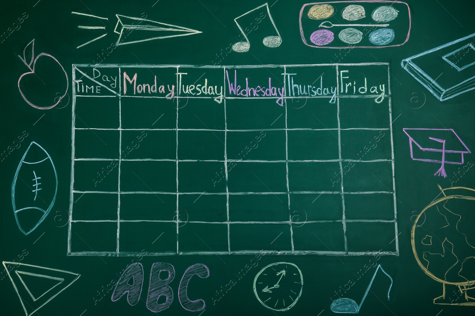 Photo of Weekly school timetable drawn on green chalkboard