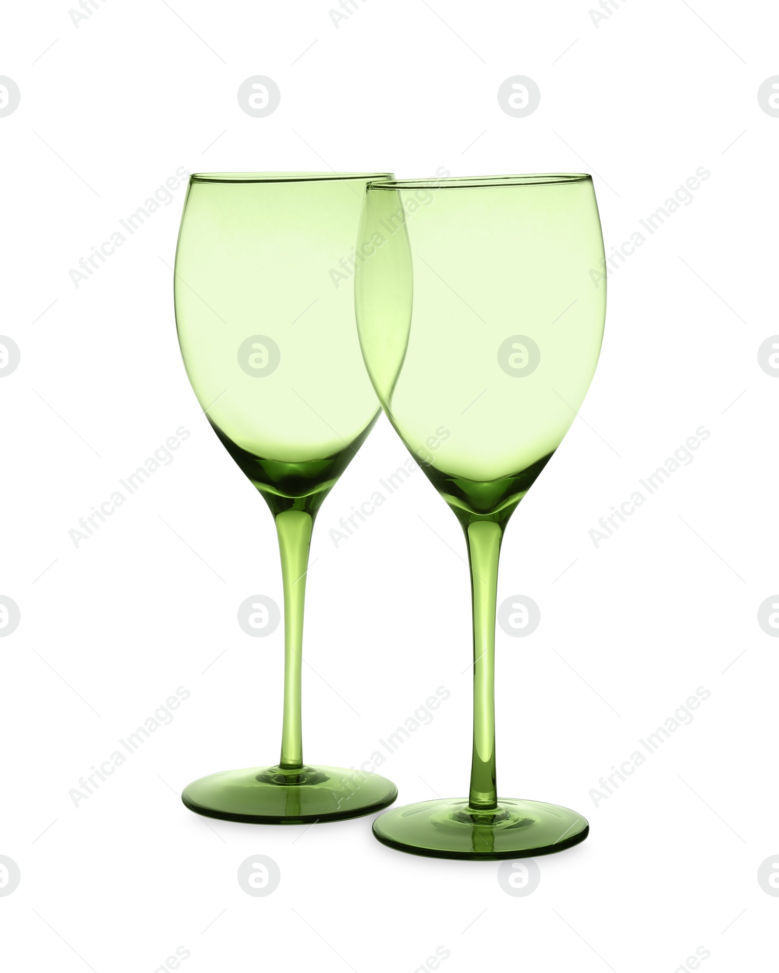 Photo of Elegant clean empty glasses on white background